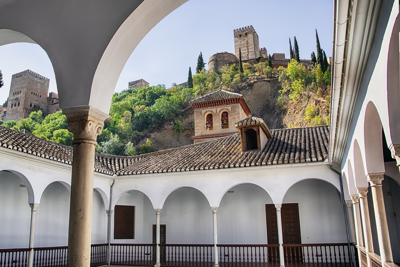 Granada travel guide: View of the Alhambra Palace from a historic courtyard in Granada, Spain.