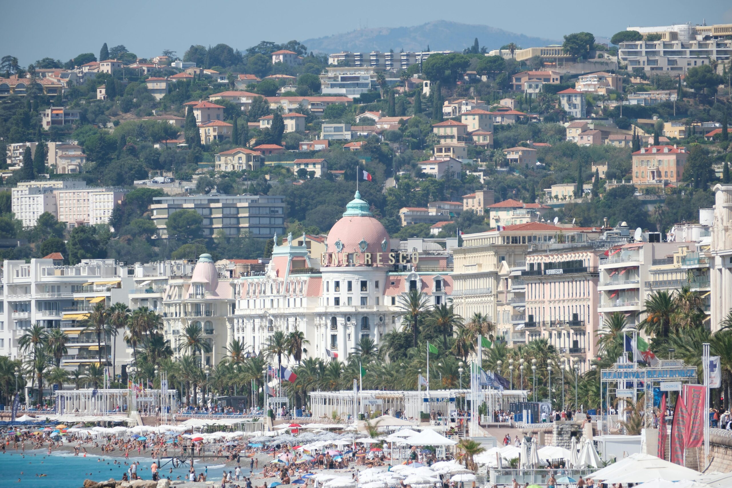 A panoramic view of Nice, France, featuring the iconic Hotel Negresco along the Mediterranean coast